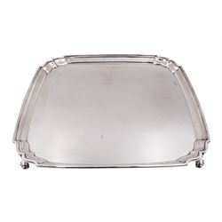 1930s silver tray, of square form with shaped canted corners and stepped rim, upon four bracket feet, hallmarked Frank Cobb & Co Ltd, Sheffield 1936, W31cm