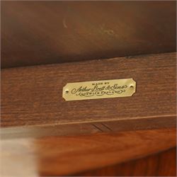 Arthur Brett & Sons - late 20th century twin pedestal dining table in the Second Empire style, the oval Amboyna burl veneered top, bordered with tulipwood crossbanding and delicate floral marquetry inlay, and rosewood crossbanded outer border within gilt gadrooned edge, over two mahogany triform pedestal bases with rosewood crossbanding and decorated with neoclassical marquetry of tied ribbons, leafy sprays, and scrolling acanthus decoration, raised on carved and gilded lion paw terminals on plinth bases, underside with maker's label