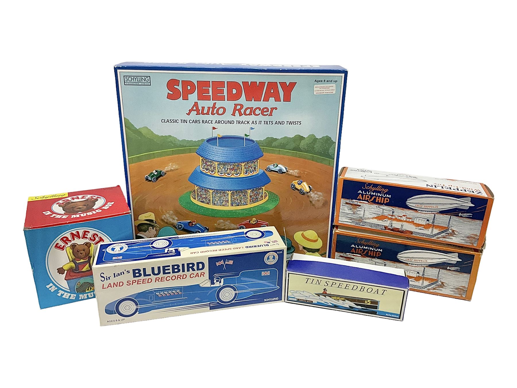 Schylling - six tinplate models comprising Sir Ian’s Bluebird racing car, Speedway Auto Racer, two Aluminium Airships, Tin Speedboat and Ernest in the Music Box; all in original boxes 