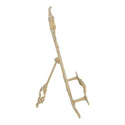 Three Baroque design brass table easels, the largest with cast mask detail, H47cm, and two matched graduated examples, smallest H25cm