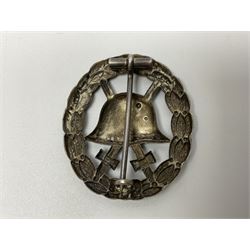 Four German awards - pre-WW2 two-position button hole ribbon for 1914 Iron Cross; WW1 wound badge open back cut-out version with silvered finish; miniature version Mother's Cross with ribbon bow; and The Eastern Medal, officially the Winter Battle in the East 1941–42 Medal (4)