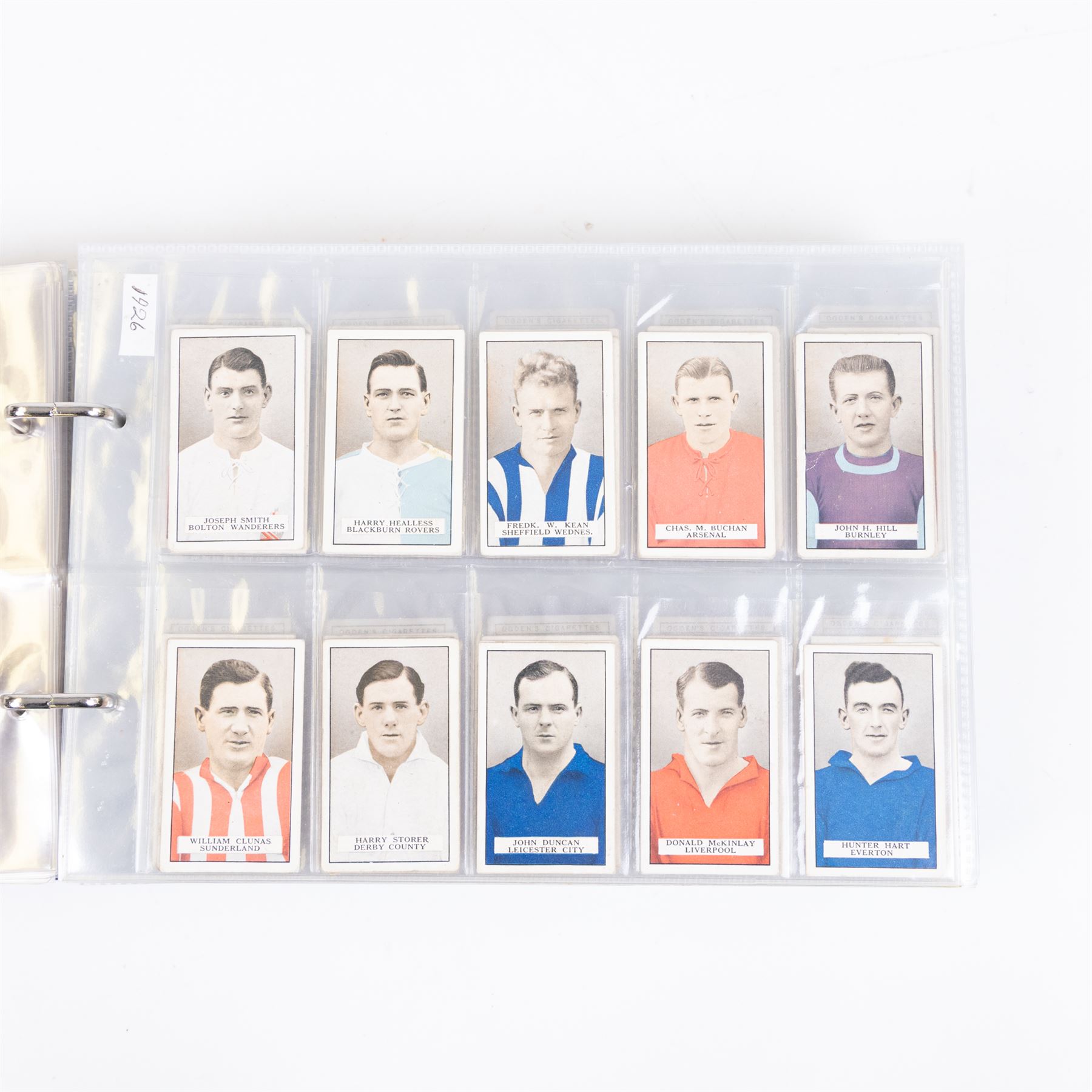 Collection of Edwardian and later Football related trading and cigarette cards, including forty-nine of fifty 1906 Ogden's Football Club Colours, 1922 PALS Footall series, ninety of one hundred 1925 Gallaher Famous Footballers, complete set of forty-four 1926 Ogden's Captains of Association Football Clubs and Colours, complete set of fifty 1927 Players Football Caricatures by MAC,  complete set of fifty 1927 Players Football Caricatures by RIP,  complete set of fifty 1930 Players Association Cup Winners, complete set of 50 1933 Ogdens AFC Nicknames etc, housed in brown cigarette card album
