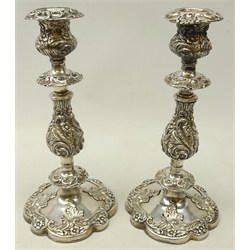  Pair 19th century silver-plated candlesticks allover embossed with stylised foliate and scrolls, H27cm   