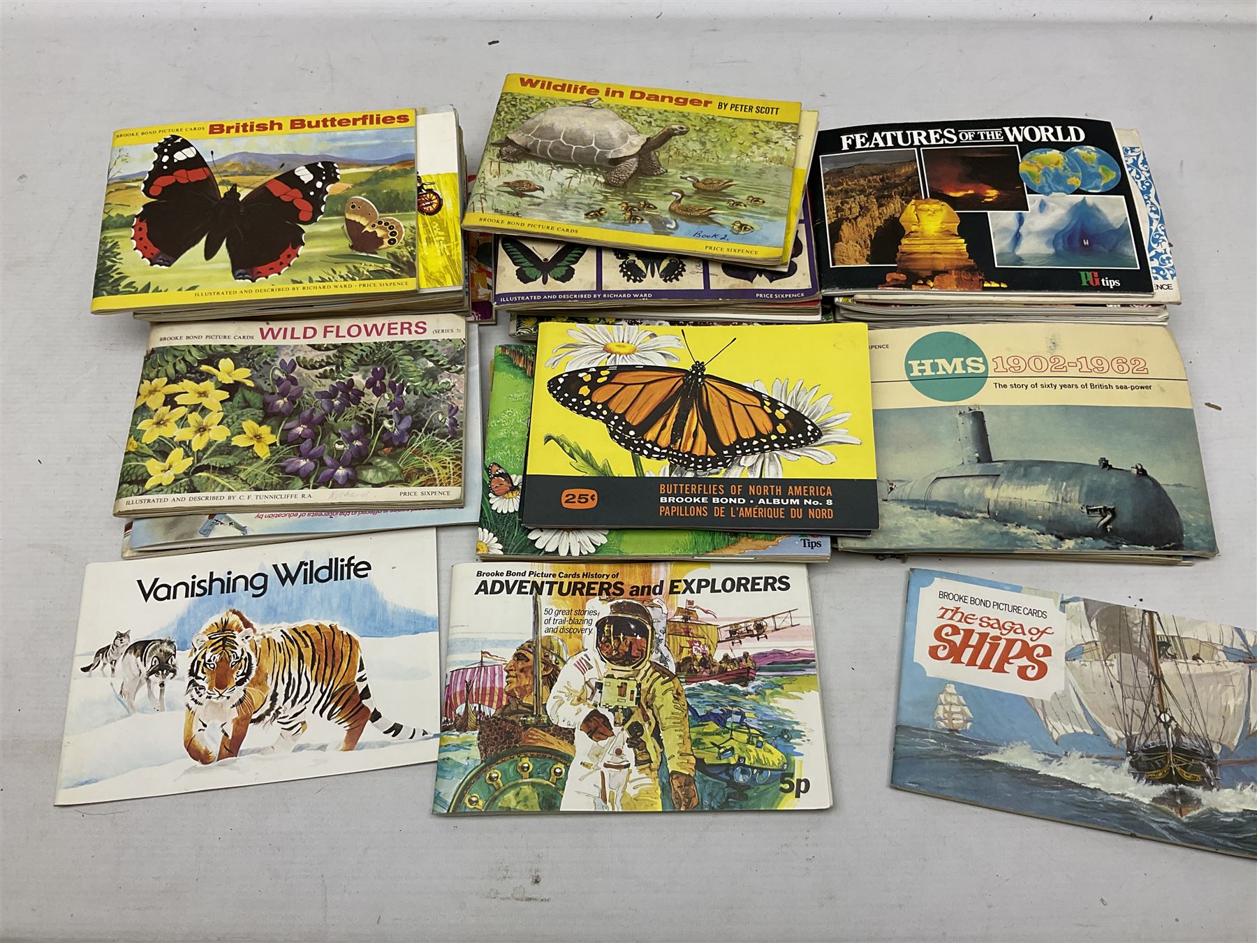 Over eighty trade card albums by Brooke Bond, Lyons, PG Tips, Hornimans, Ty-Phoo etc including some duplicates; and large quantity of loose trade cards