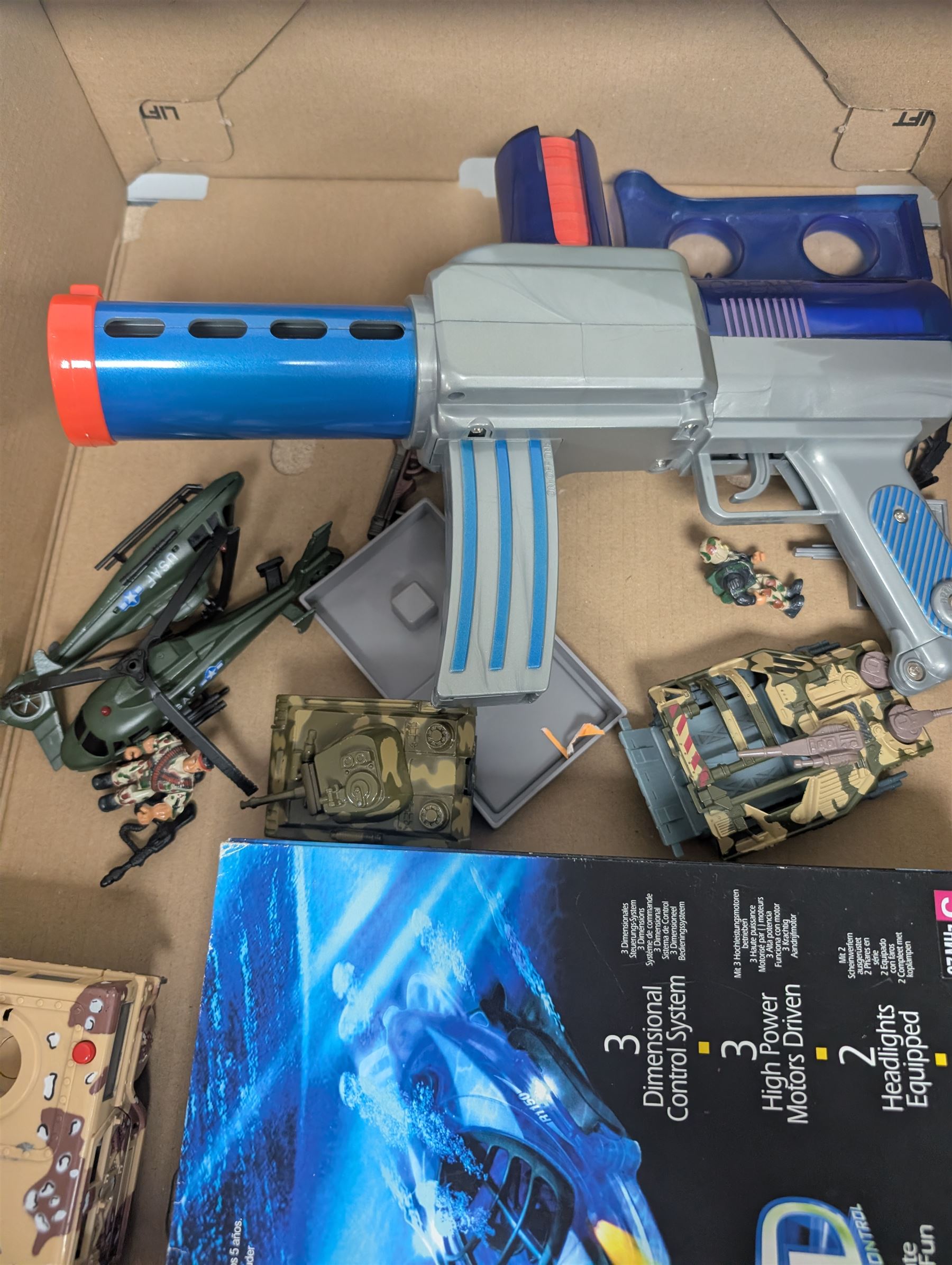 Collection of toys, including Matchbox Old Mother Hubbard's shoe, Tomy Zoids Blade Liger, Air Hogs radio controlled helicopter, diecast tanks etc, 