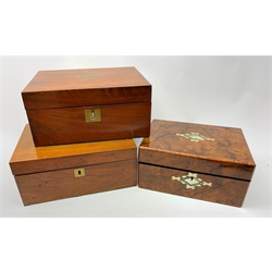  A 19th century figured walnut box, with inset mother of pearl and abalone detail, H13cm L27cm, together with two 19th century mahogany writing slopes, each with vacant brass cartouche to the hinged opening cover, largest H14cm L30cm.   