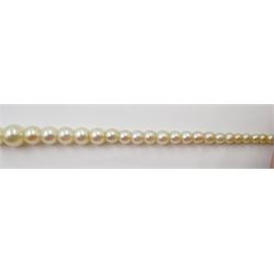 Three strand pearl necklace, with platinum diamond milgrain clasp and a single strand graduating pearl necklace with 18ct white gold clasp set with a diamond