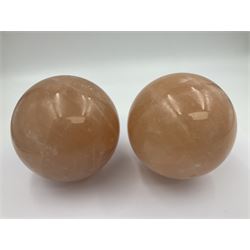 Pair of orange calcite spheres, D10cm  