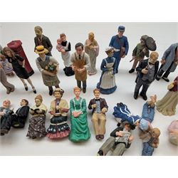 1:12 scale dolls house composite figures, including policeman, postman, maid, sitting and standing people in various styles of dress, etc