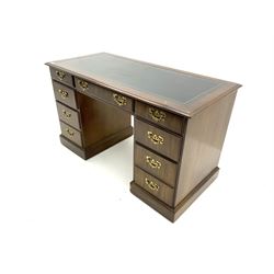 Mahogany twin pedestal desk, moulded rectangular top with inset leather, fitted with seven drawers, plinth base