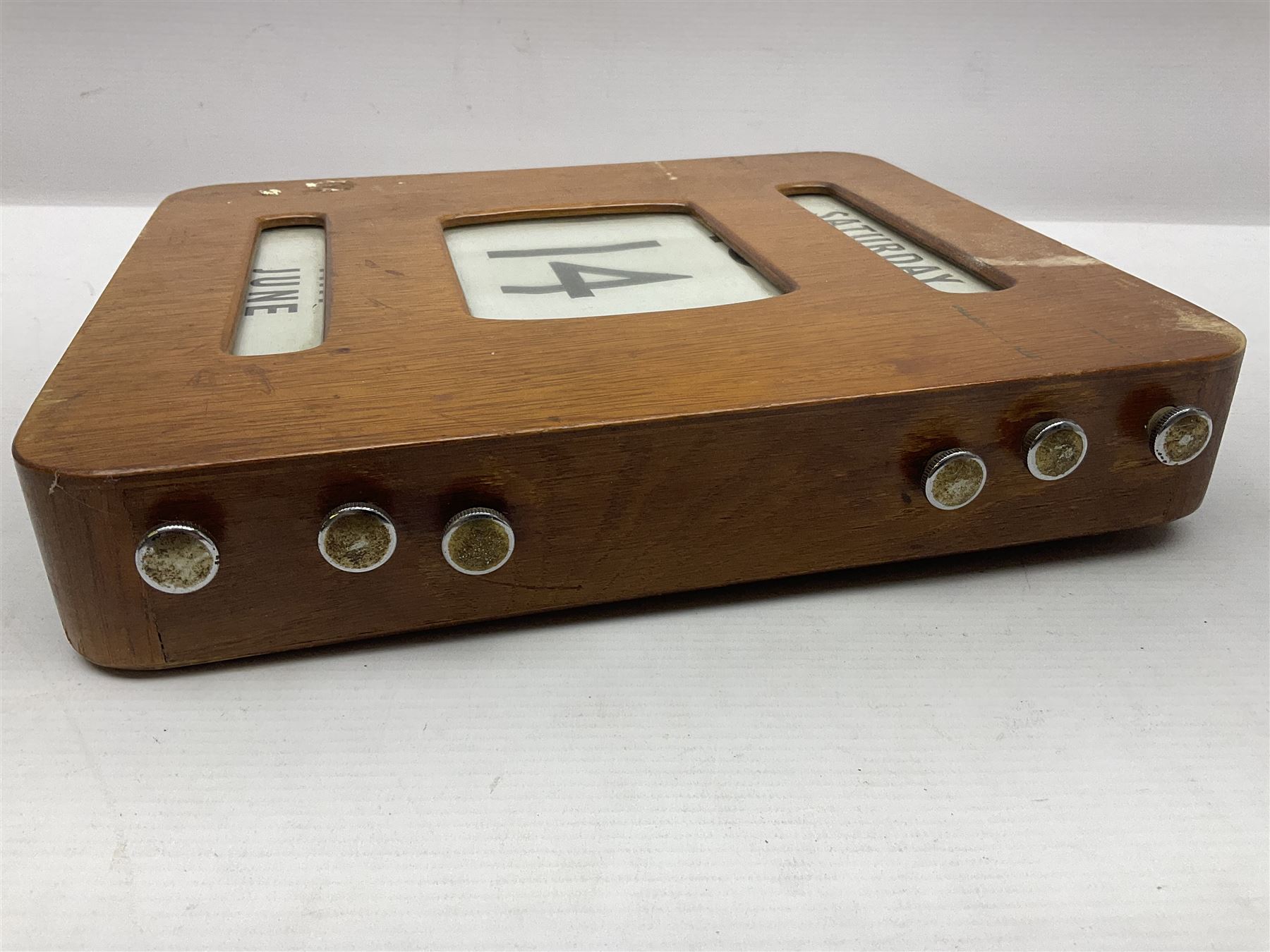 Wooden wall mounted perpetual calendar with printed rollers and chrome plated knobs to side, H30cm W27cm