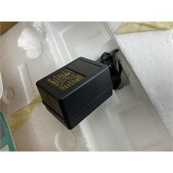 Six Disney Winnie the Pooh Christmas snow globes, comprising large Mr Christmas Holiday Snowfall, An Enchanted Christmas, It's A Small World Christmas 1994,  Tree Trimming, 1995 Christmas At Our House and Christmas Band Concert, together with Mr Christmas Holiday Go Round, all with boxes (7)