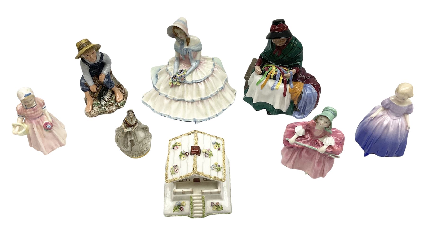 Group of figures, comprising six Royal Doulton examples, Daydreams HN1731, Silks and Ribbons HN2017, Tom Sawyer HN2926, Marie HN1370, Bo-Peep HN1811, and Tinkle Bell HN1677, together with a Dresden type 'lace' example, and a Coalport 'Swiss Cottage', (8)