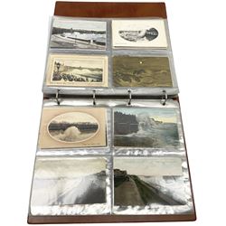 Edwardian and later postcards mostly relating to stormy seas, housed in a ring binder album, approximately 160