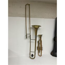 Three brass trombones comprising Elkhart Ind. USA 'CONN' model no.72H; Besson 'Concord'; and Selmer Distributed 'Lincoln'; two in carrying cases; and German B & M 'Champion' brass trumpet (4)