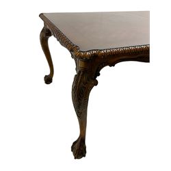 Chippendale Revival - hardwood extending dining table, rectangular gadroon carved top, on acanthus carved cabriole supports with ball and claw feet, with two additional leaves; together with a set of eight (6+2) dining chairs, shaped cresting rail over pierced and carved splat, upholstered drop-in seat, on acanthus carved cabriole supports with ball and claw feet