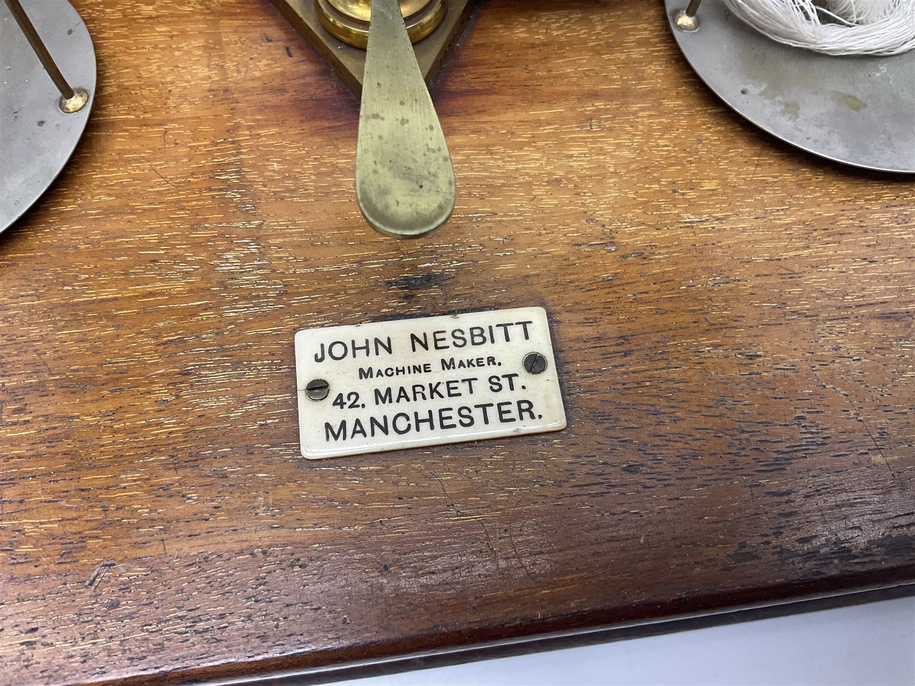 Collection of textile equipment, comprising, Goodbrand & Co. mahogany and brass yarn tester, Negretti & Zambra barograph and two sets of precision scales