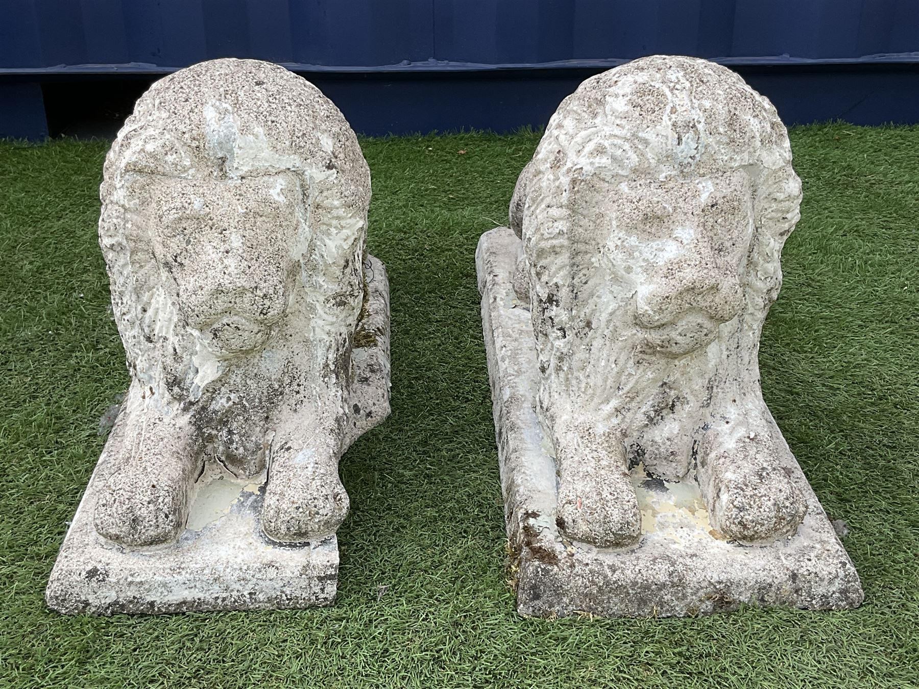 Pair composite stone garden recumbent lions - THIS LOT IS TO BE COLLECTED BY APPOINTMENT FROM DUGGLEBY STORAGE, GREAT HILL, EASTFIELD, SCARBOROUGH, YO11 3TX