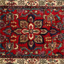 North West Persian Mahal hand-knotted runner, deep red ground, with a vertical arrangement of angular floral and geometric motifs, enclosed by an ivory border  of stylized leaves and rosettes, with guard stripes on indigo ground, cotton fringe ends 