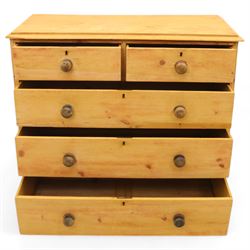 Victorian stripped pine chest, fitted with two short and three long drawers, turned wooden handles, shaped lower apron on bracket feet