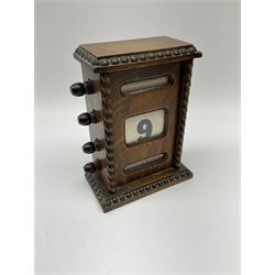 A small Victorian oak cased perpetual calendar with beaded and barley twist detail H16cm, together with a Georgian mahogany tea caddy.