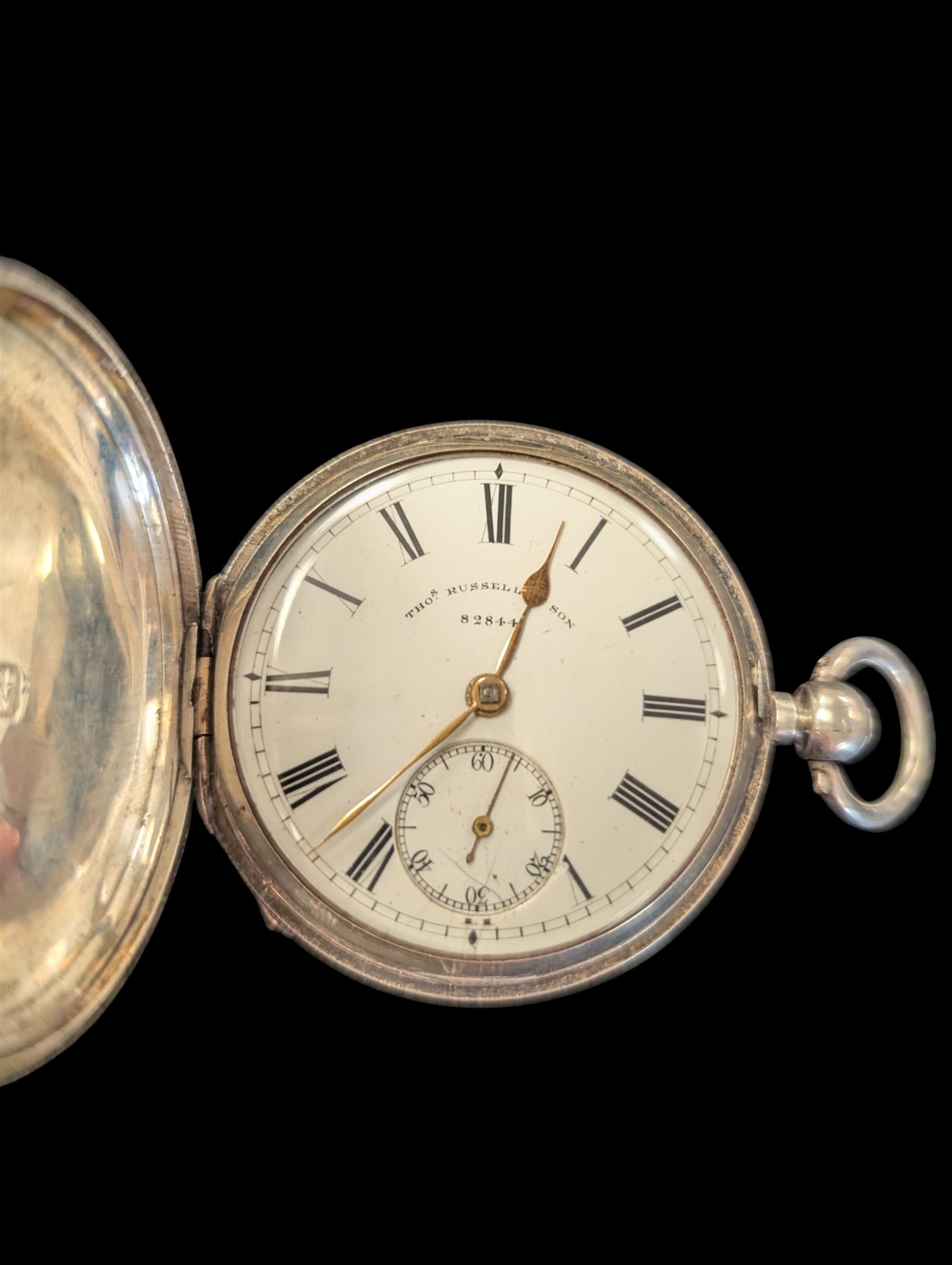 Late Victorian silver full hunter pocket watch by Tho Russell & Son no. 82844, with white enamel dial and subsidiary seconds dial, the front cover with blank cartouche, hallmarked Chester 1891