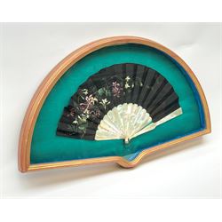 Framed oriental fan with mother-of-pearl sticks and guards and black cloth fan, L74cm 