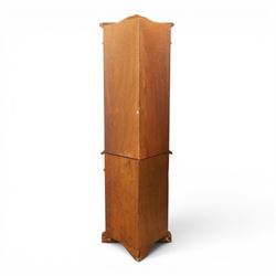 Victorian design mahogany corner cabinet, shaped carved cresting above bowed glazed upper door, with panelled side uprights, lower drawer over cupboard door decorated with floral marquetry, on plinth base