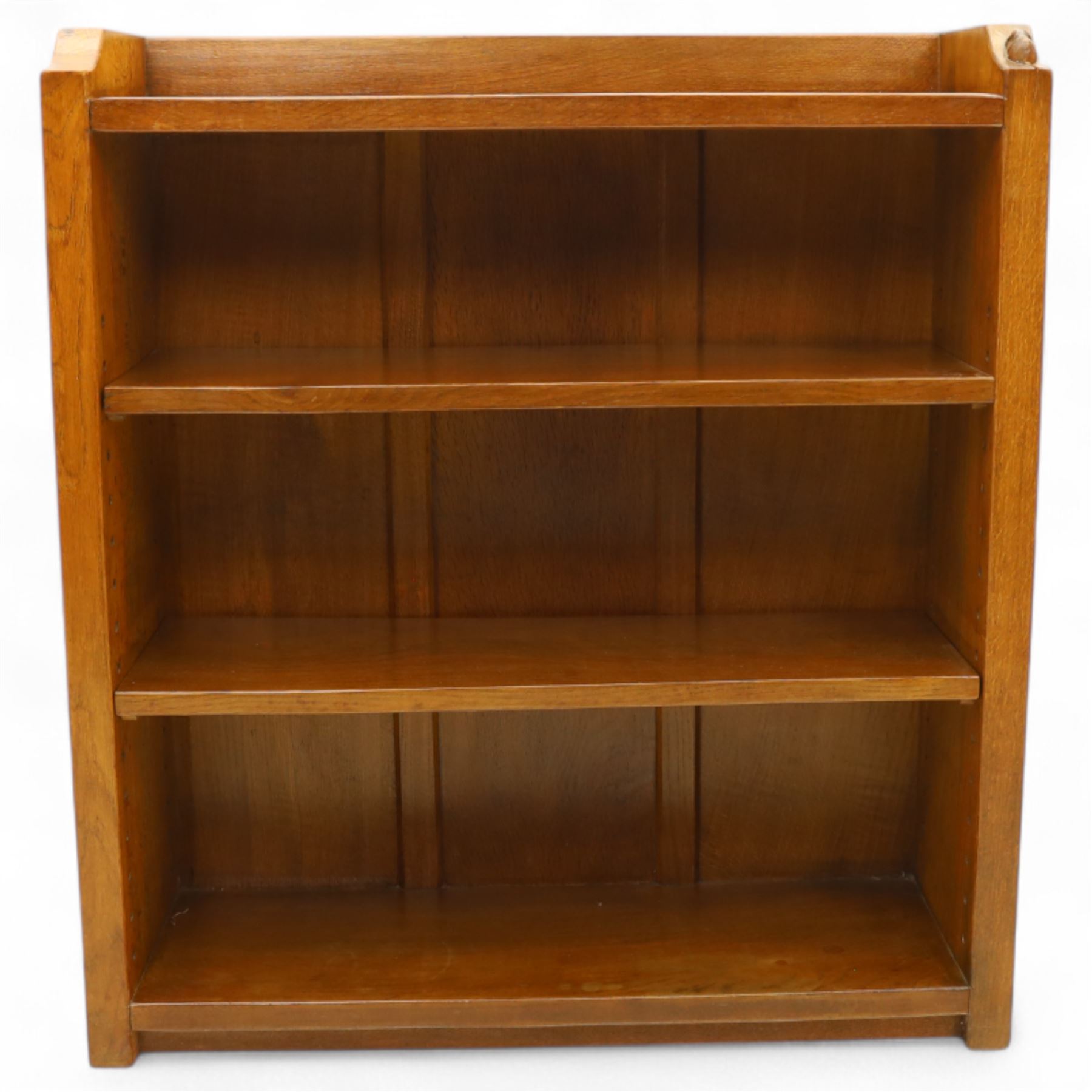 Mouseman - oak open bookcase, galleried top with the signature mouse motif carving, two adjustable shelves, by the workshop of Robert Thompson, Kilburn