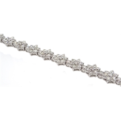  White gold flower design line bracelet, stamped 18K, total diamond weight 5.20 carat  