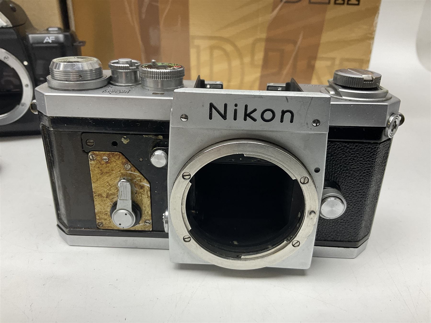 Nikon F-401 camera body, serial no. 2064766, together with Nikon Shutter Speed range, serial no.106395, and other Nikon equipment and camera bodies 