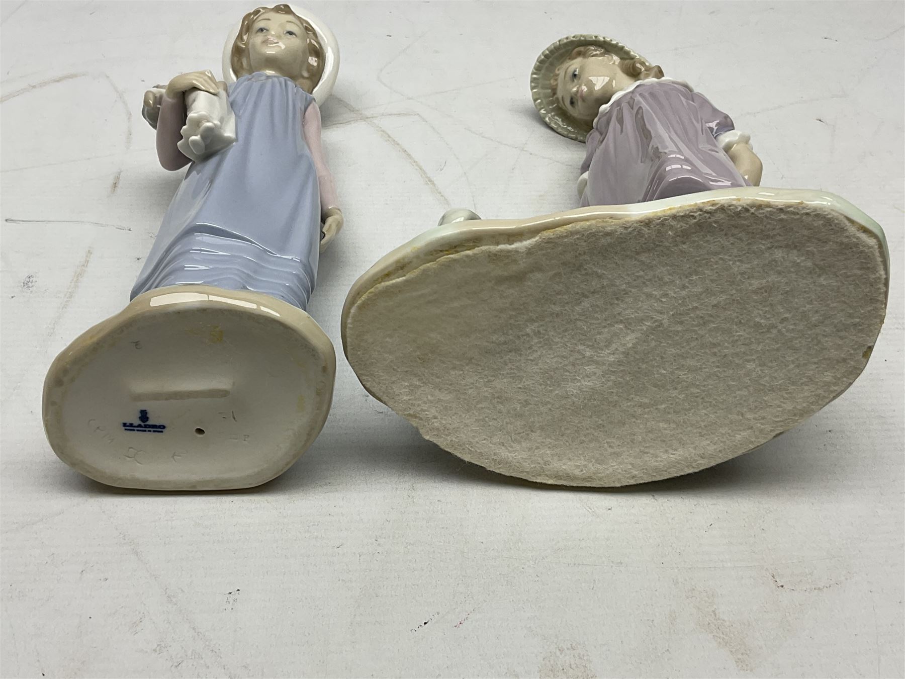 Four Lladro figures, comprising Pulling Dolls Carriage no 5044, Belinda with her Doll no 5045, Pretty Pickings no 5222 and Shepherdess with basket no 4678 