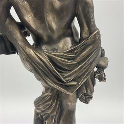 20th century silver plated figure, modelled as a classical male figure, possibly Prometheus, holding flames, one foot resting atop a small dragon, upon a circular spreading base, overall H37.5cm