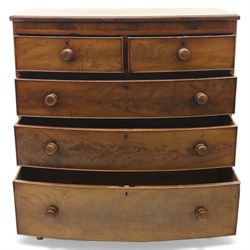 19th century mahogany bow-front chest, with two short over three long graduated drawers, fitted with turned wooden knobs, raised on turned bun feet