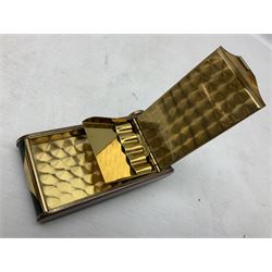Art Deco camera shaped lady's musical compact and cigarette case, probably German, with green marble effect panels and gilt highlights, with large hinged opening to reveal engine turned brass interior with cigarette or lipstick holders, and the other side with musical mechanism and flip action powder compartment with mirror, L10cm