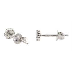 Pair of platinum round brilliant cut diamond flower cluster stud earrings, hallmarked