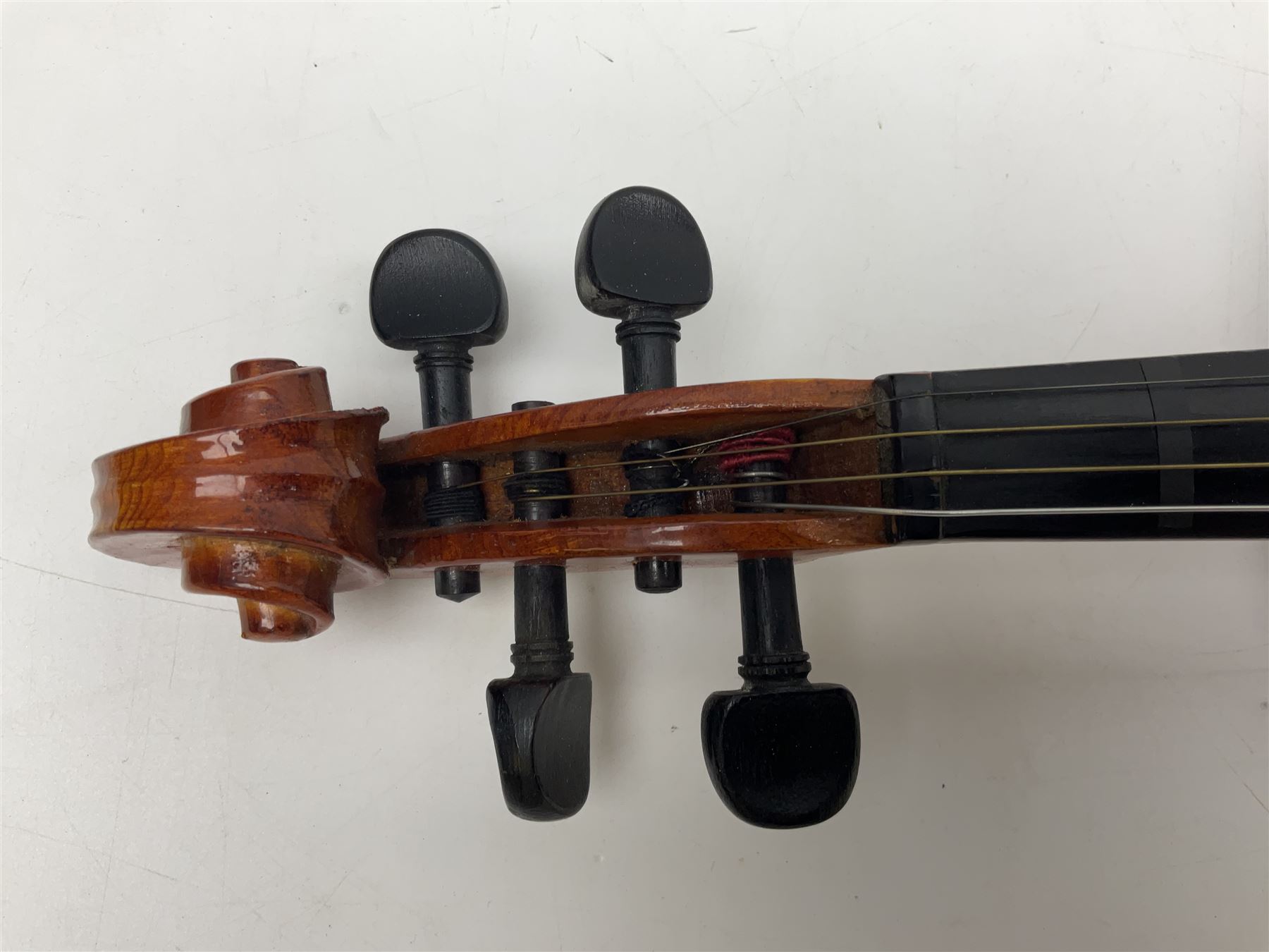 Four student violins - two Chinese three-quarter size with 33.5cm and 34cm two-piece backs; Stringers of Edinburgh quarter size with 28cm two-piece back; and Stentor quarter size with 28cm two-piece back; each in carrying case (4)