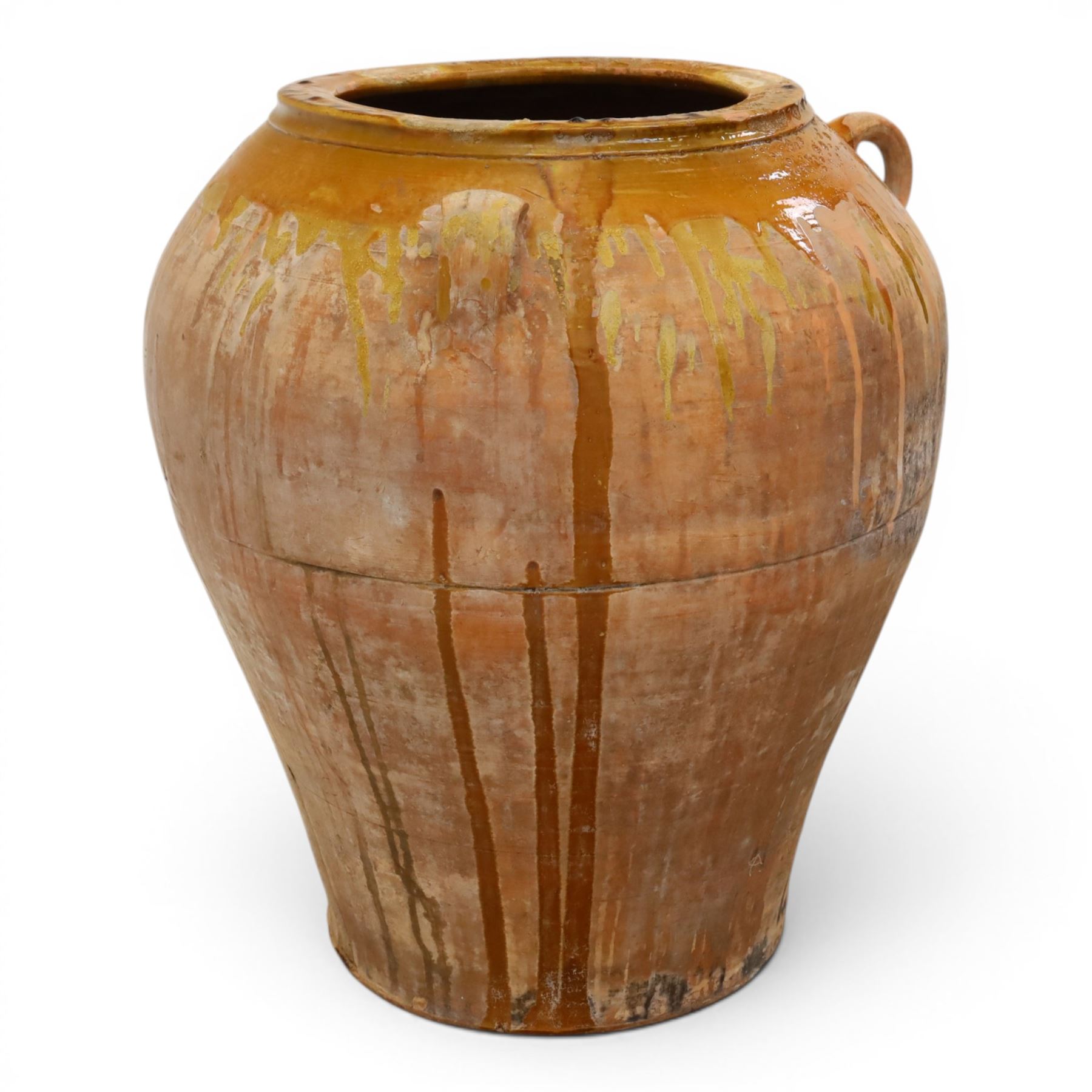 Large Spanish terracotta olive jar, of typical baluster form with drip glaze decoration and three lug handles, with impressed mark fabrica de alfareria, H58cm