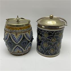 A 19th century Doulton Lambeth stoneware tobacco jar with a silver plate lid, rim and handle, the body with relief moulded foliate decoration, with impressed marks and monogrammed for W Baron beneath, H20cm, together with a further stoneware tobacco jar with silver plated lid, rim and handle, (unmarked), H20cm. 