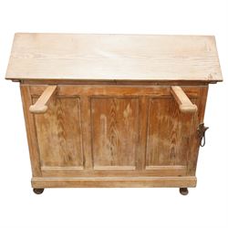 Musgrave & Co Ltd (Belfast) - late 19th century pine saddle horse, with three drawers to one end and cupboard door to the other, the hinged top opening to form a table, the cast iron plaque bears the Royal coat of arms and maker's name