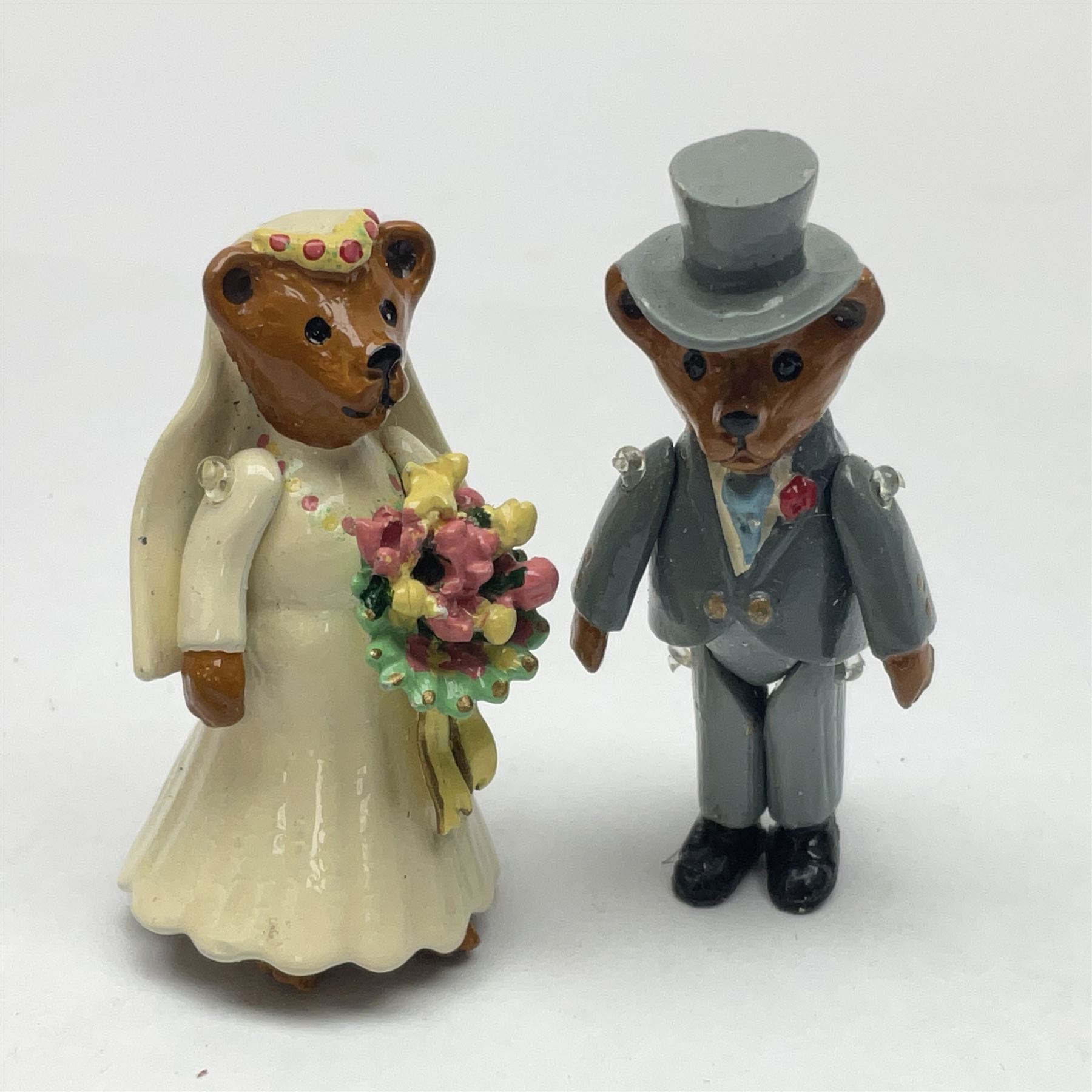 Seven Hantel miniature articulated pewter teddy bears, including bride and groom 