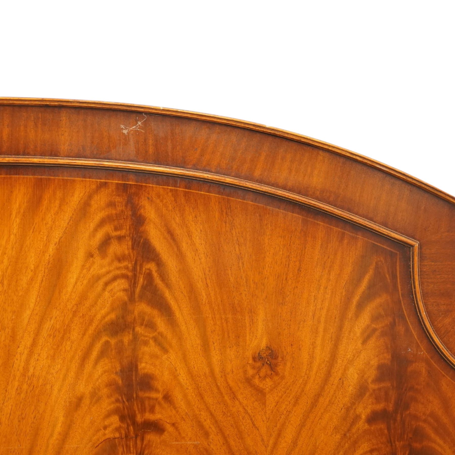Two 20th century headboards, one with scrolled rail above a pink button backed board (H c127m, W 137cm) the second with flamed mahogany veneer (H 117cm, W 163cm)