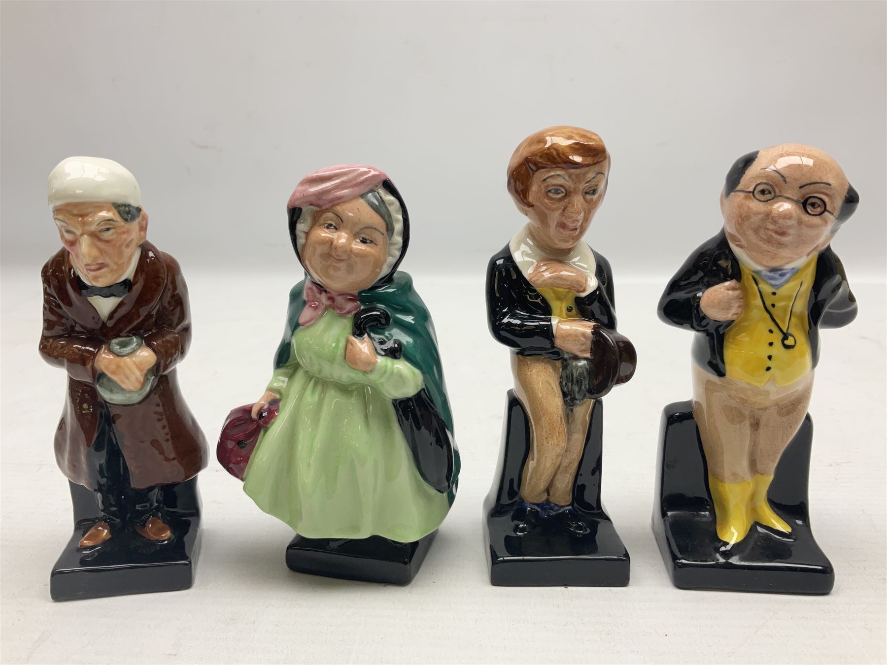 Seventeen Royal Doulton Charles Dickens figures, to include Bumble, Sairey Gamp, Scrooge, Dick Swiveller, Little Nell etc, all with printed marks beneath