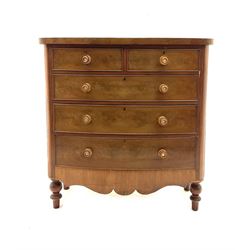 Victorian mahogany bow front chest, fitted with two short and three long drawers, raised on turned supports 