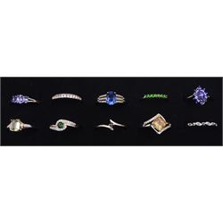 Ten silver stone set rings, including tanzanite, hiddenite and topaz, all stamped or hallmarked 