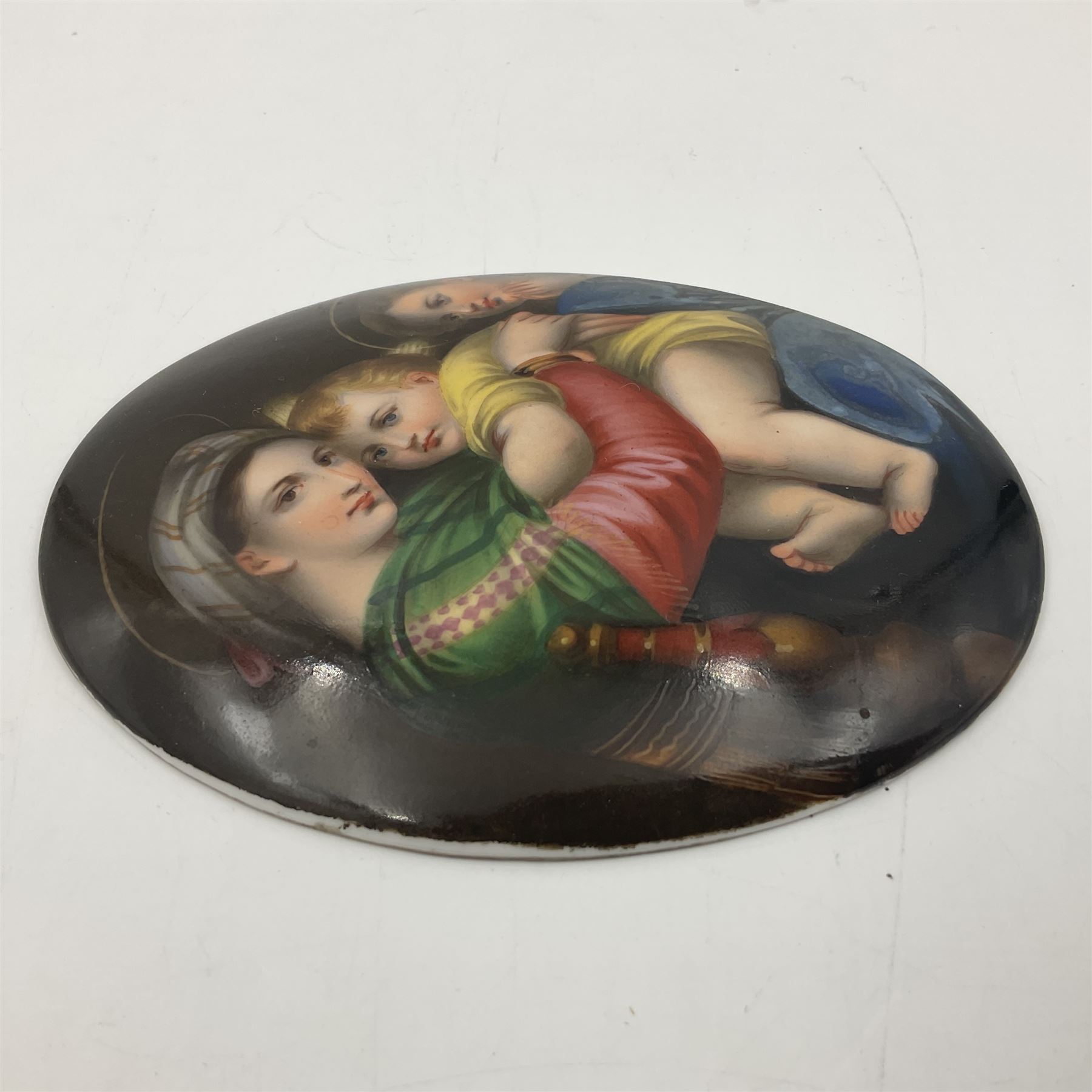 19th century Continental porcelain plaque, of oval form, painted with the Madonna and Child after Raphael, unmarked, possibly KPM, H12cm W9cm 