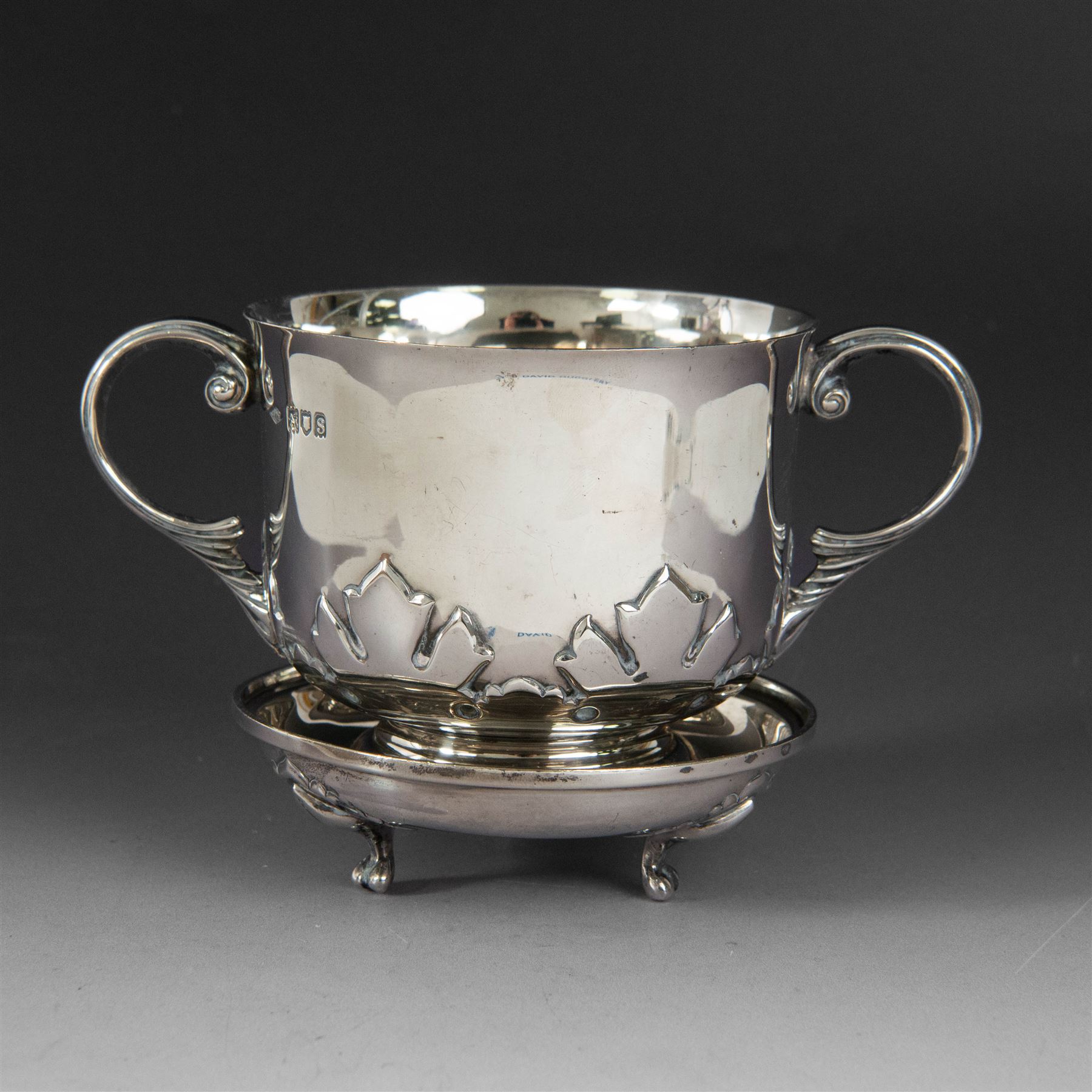 Early 20th century silver porringer, decorated in relief with foliate decoration and later engraving to body, upon a stepped circular foot, with matching cover/stand, both hallmarked Johnson, Walker & Tolhurst, London 1913, H8cm