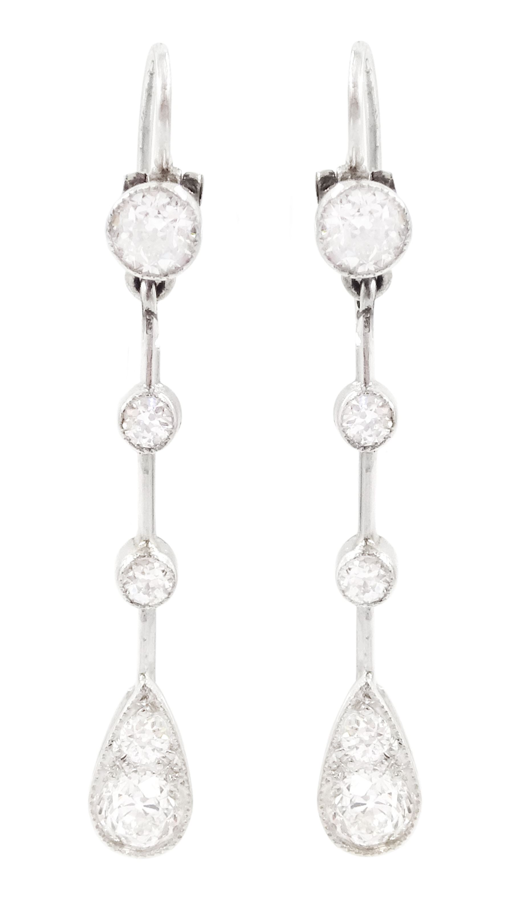 Early 20th century platinum diamond earrings, circa 1930, each pendant milgrain set with old cut diamonds, spaced by knife edge bars, to shepherd's hook back, total diamond weight approx 0.55 carat 
