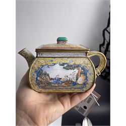 Chinese Qianlong enamel bombé shaped teapot, decorated with scenes of scholars examining a scroll and drinking on a yellow ground with various traditional floral and foliate motifs, the painted scene framed within trailing blue vine border, with Qianlong marks to base L15cm