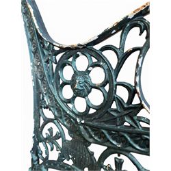 Pair of ornate painted cast iron bench ends, painted in green